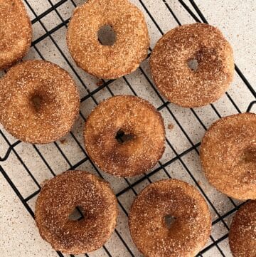 baked apple cider donuts on a cooling rack