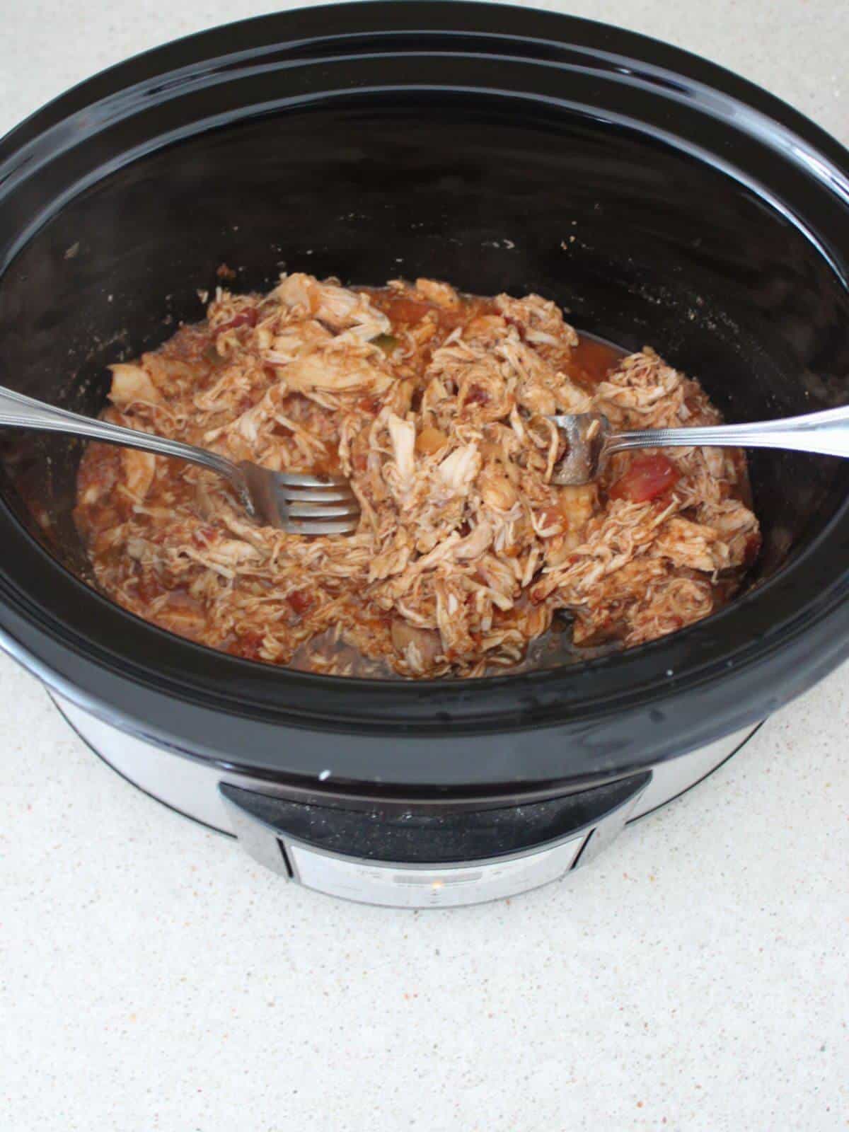 Salsa Chicken cooked and shredded in the crockpot.