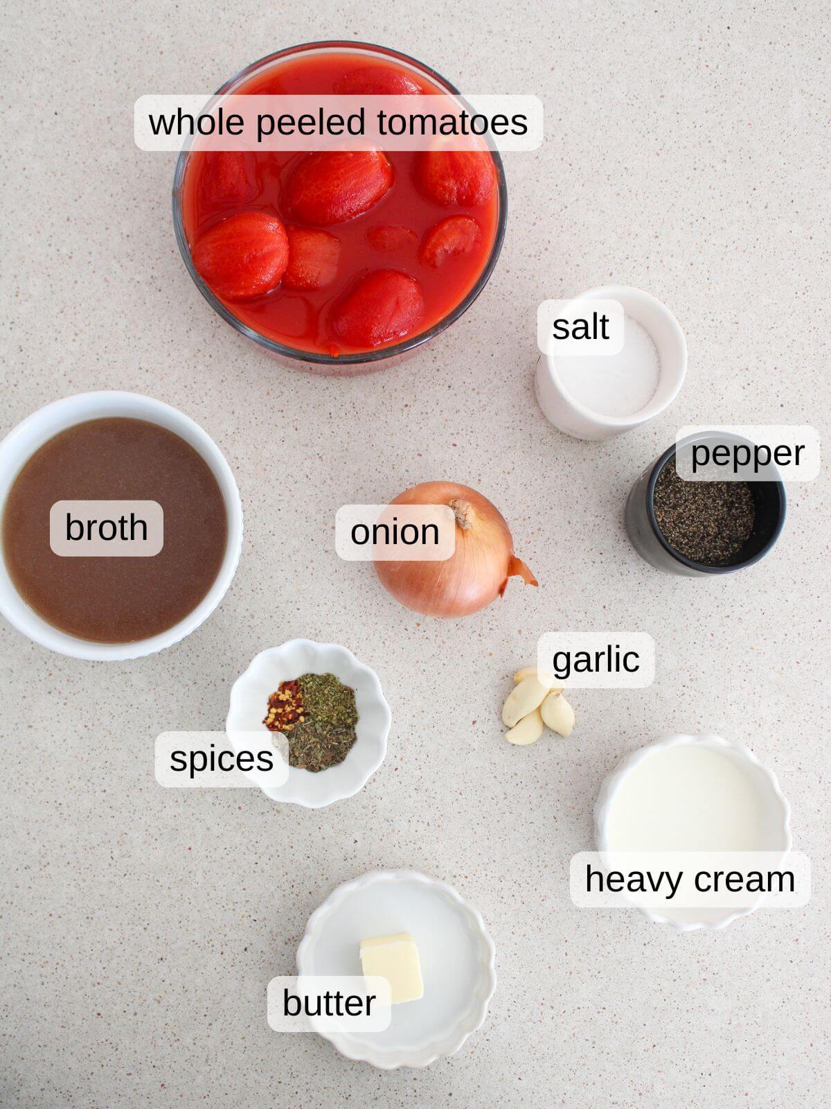 Flat lay of the ingredients needed for the creamy tomato soup