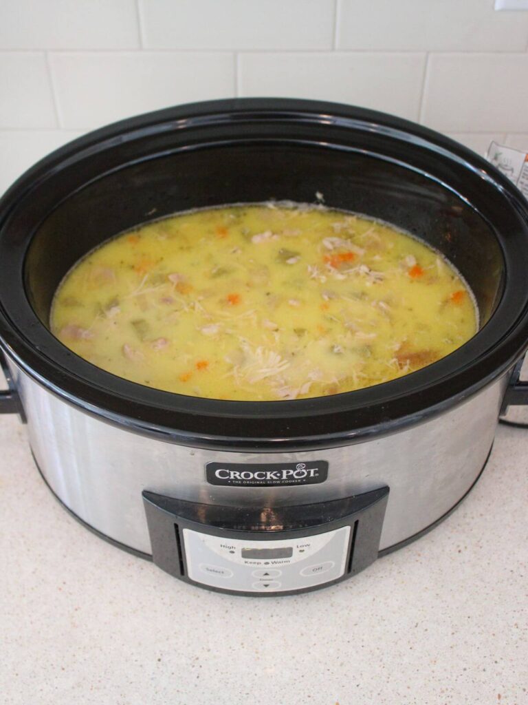 shredding the chicken and thickening the broth in the crockpot