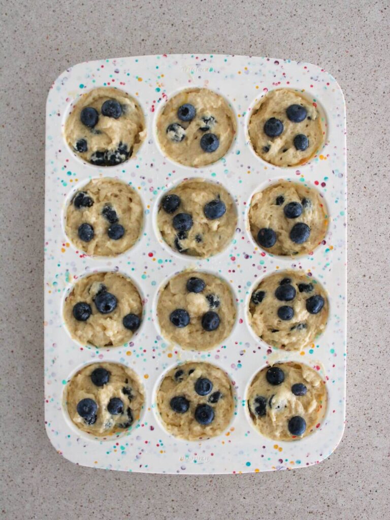 Muffins ready to bake in a silicone muffin tin