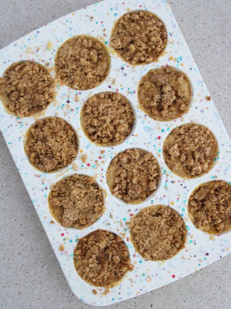 Muffins assembled and ready to bake in a silicone muffin pan