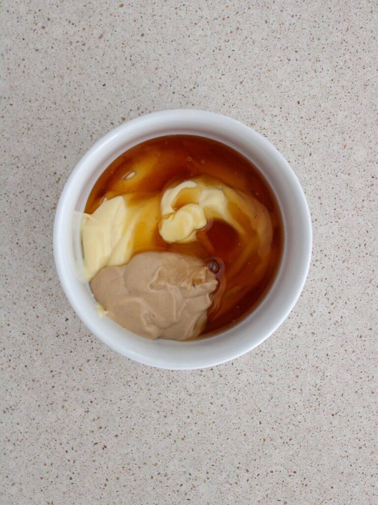 mayo, honey, and dijon mustard added to a white bowl