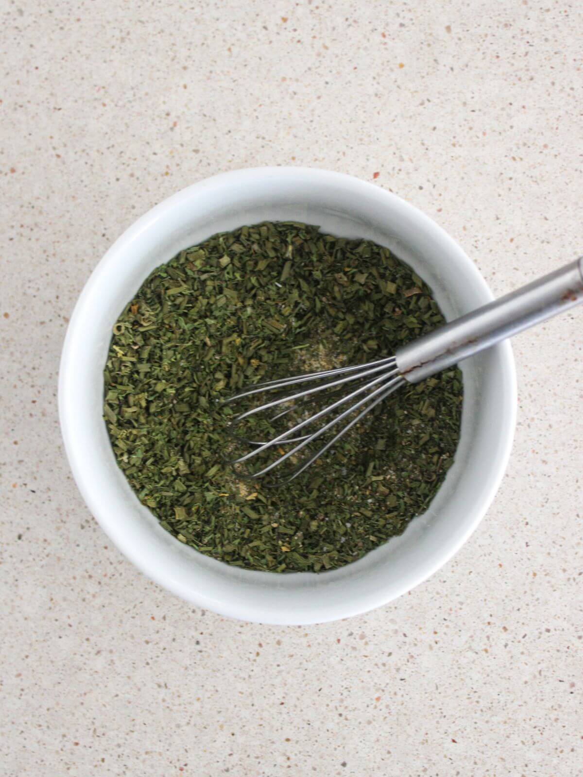 ingredients whisked in the white bowl