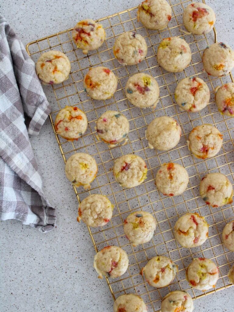 Mini Pancakes on a cooling rack with a plaid napkin next to it
