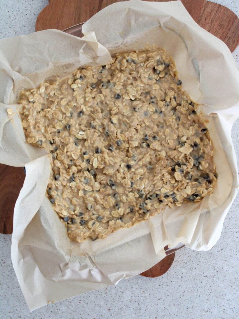 spreading the mixture into a parchment lined glass pan