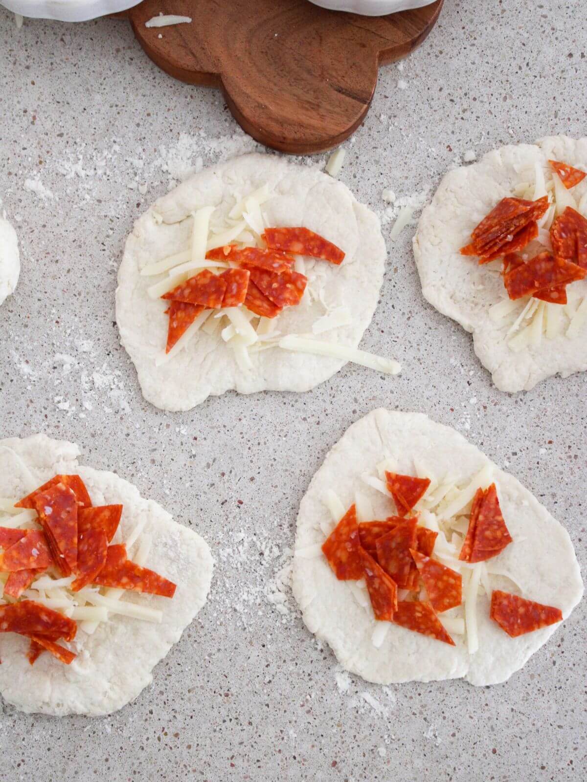 the dough rolled out and stuffed with mozzarella and pepperoni