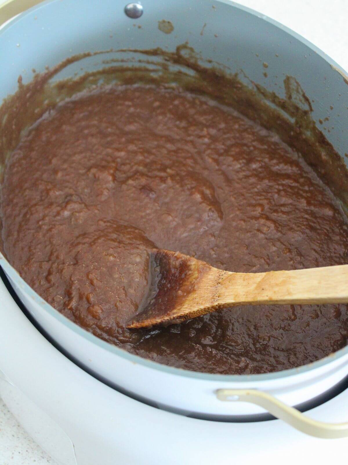 the apple butter all mixed together thickening in the slow cooker