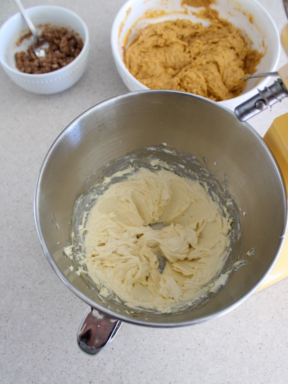Mixing the cream cheese center in a stainless steel kitchen aid bowl